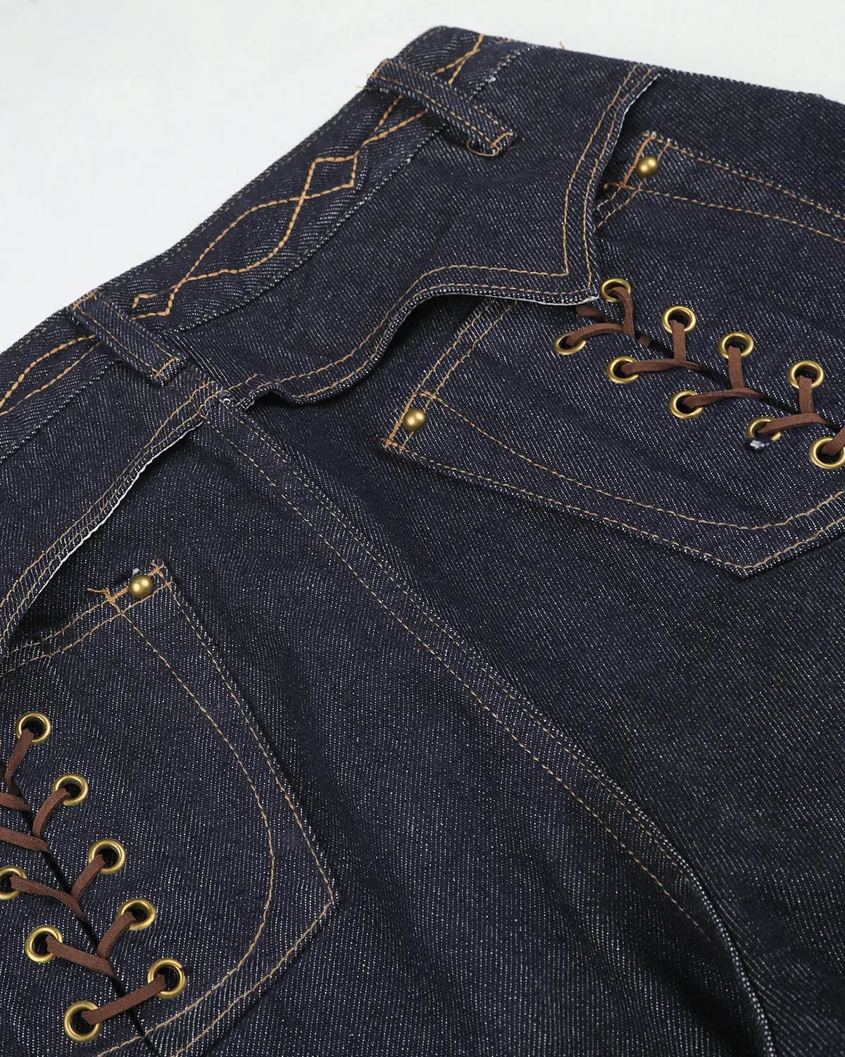 Black side lace-up raw baggy jeans by Flation Streetwear, featuring a loose fit and raw hem detail.
