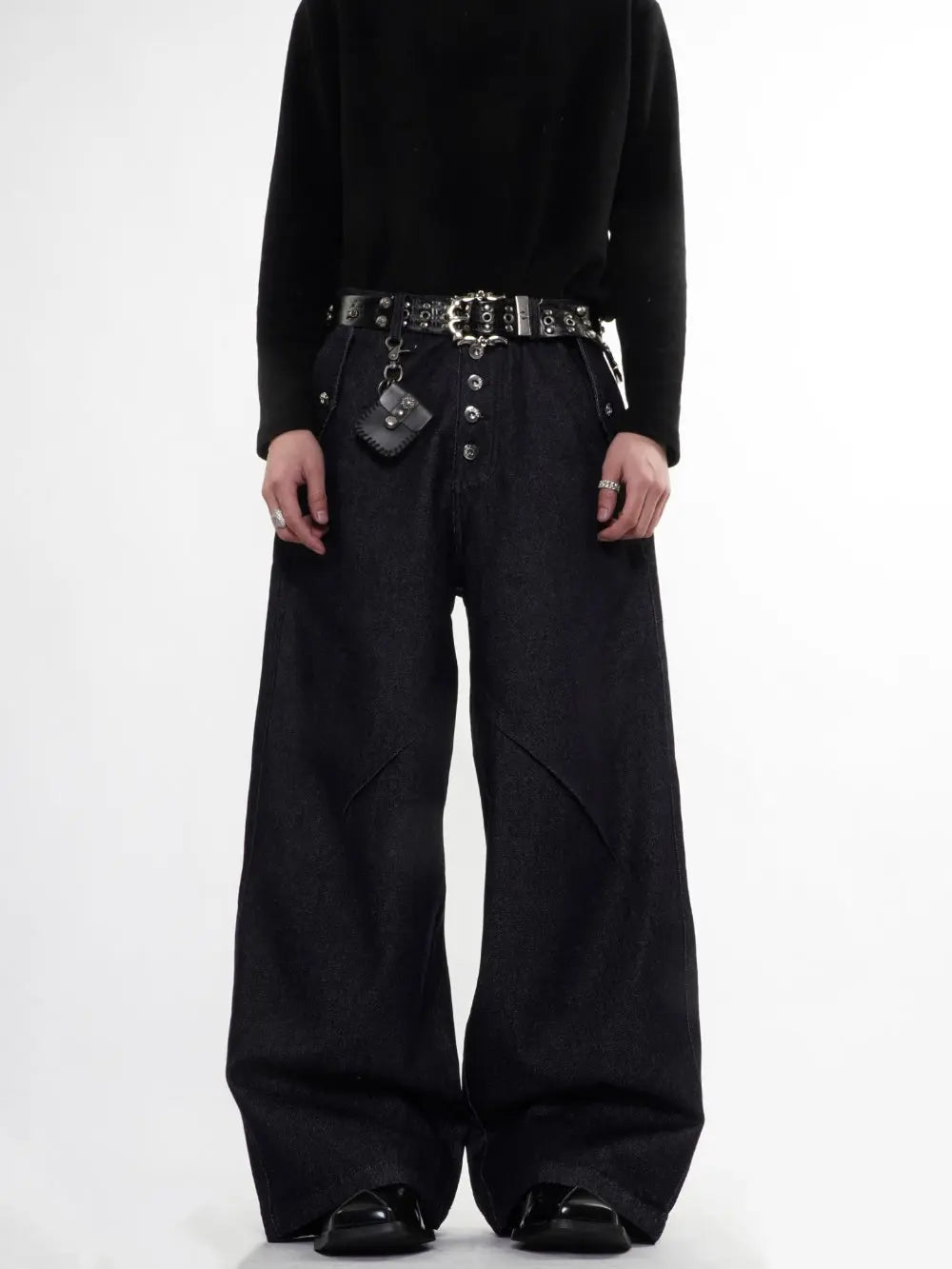 Raw blue baggy jeans by Flation Streetwear featuring button-up front and relaxed fit, shown on a model.