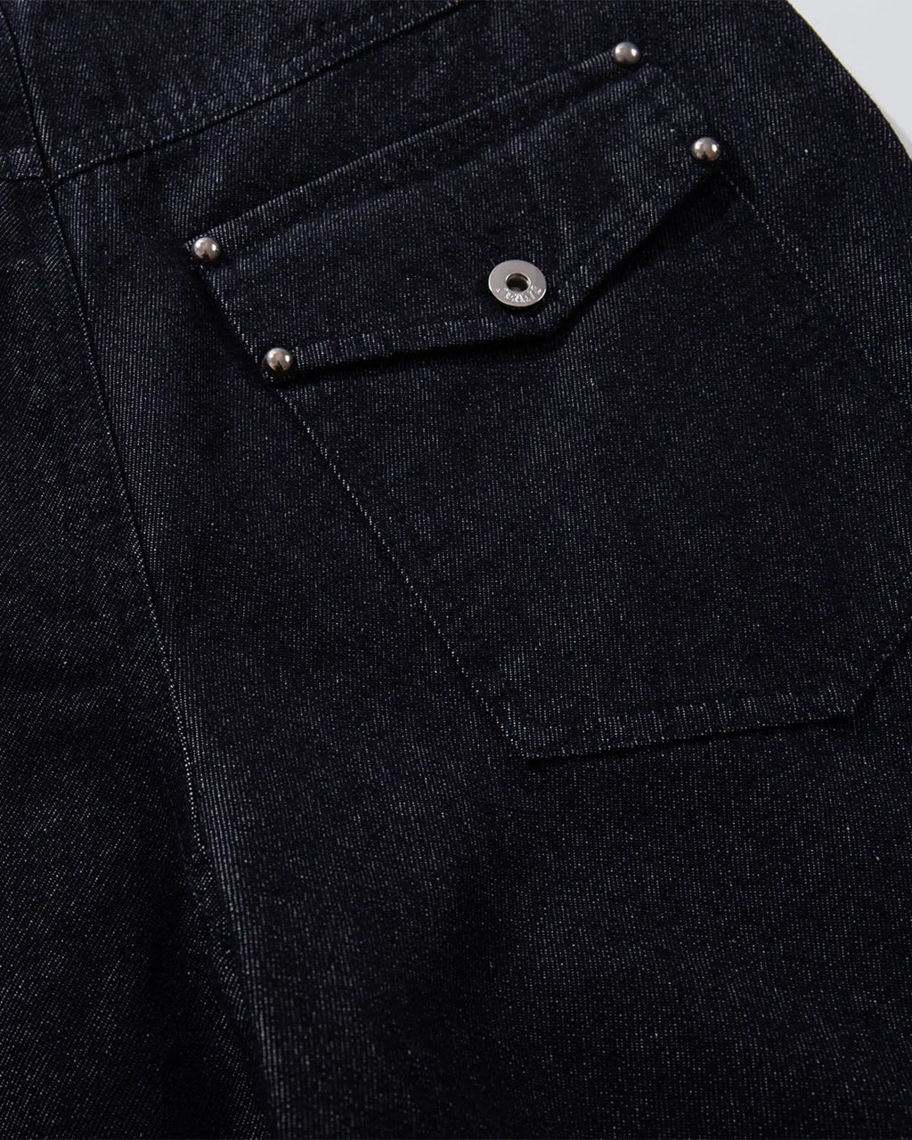 Pair of Flation Raw Blue Baggy Jeans with button-up front, relaxed fit, and streetwear style, shown in natural daylight.