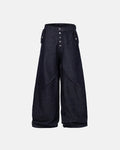 Blue baggy jeans with button-up fly from Flation Streetwear, featuring a relaxed fit and raw denim finish.