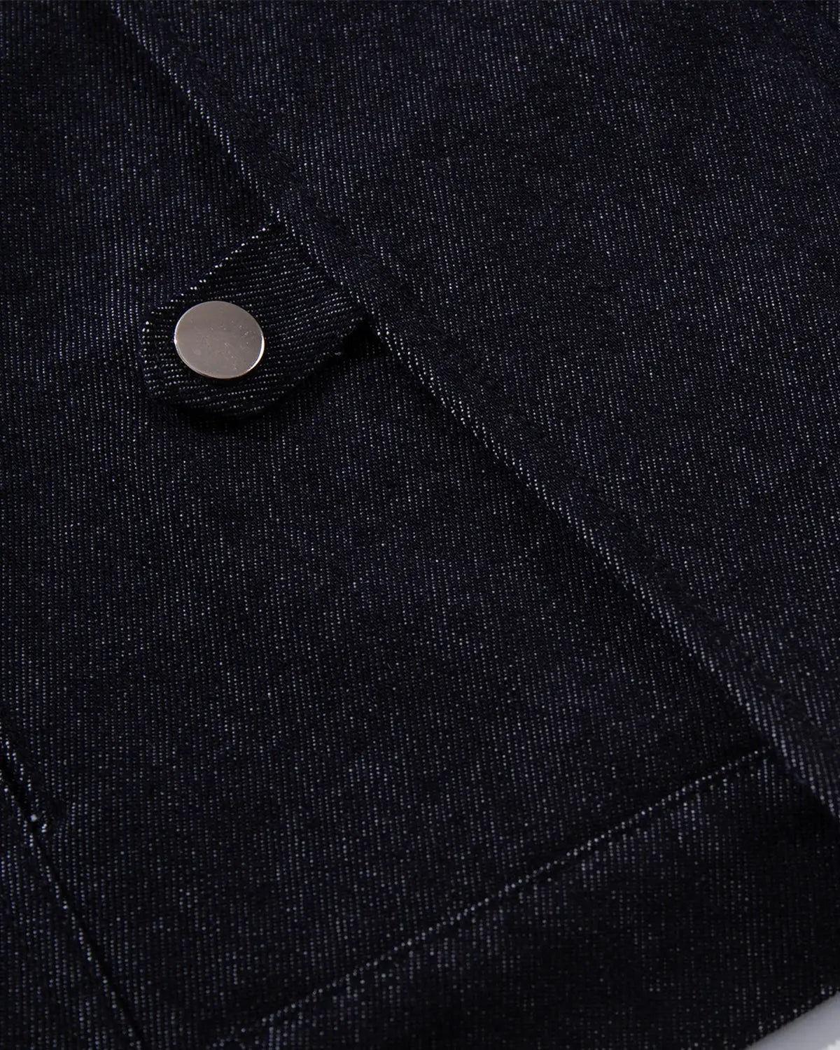 Raw blue denim Fireman Clasp jacket by Flation with front button closure and streetwear style, shown on a hanger.
