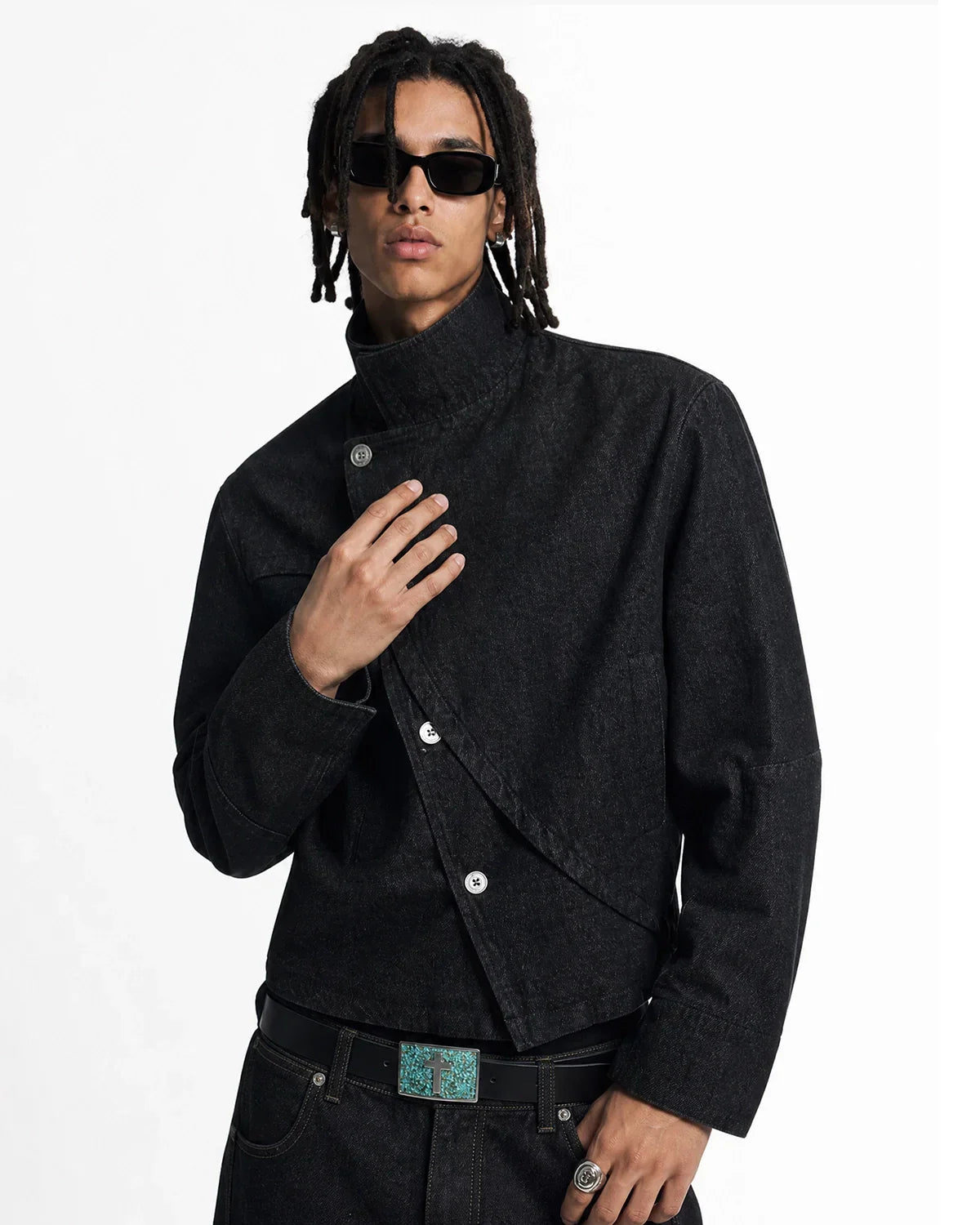 Cropped asymmetric denim jacket by Flation Streetwear with button details and raw hem, styled for casual street fashion.