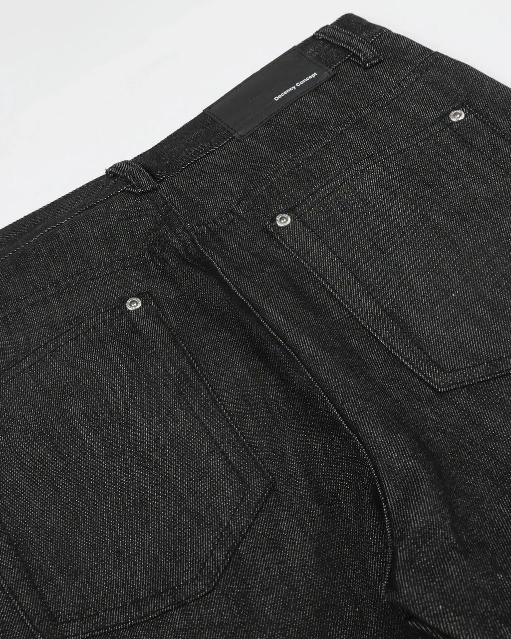 Raw baggy jeans with button details from Flation Streetwear, featuring a relaxed fit and distressed denim style.