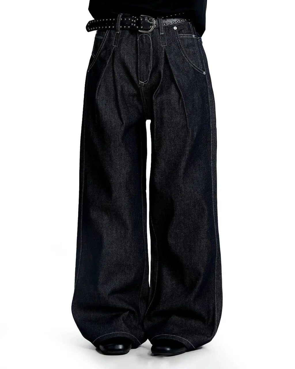 Raw baggy jeans with contrast stitching by Flation Streetwear, showing relaxed fit and detailed stitching on denim fabric.