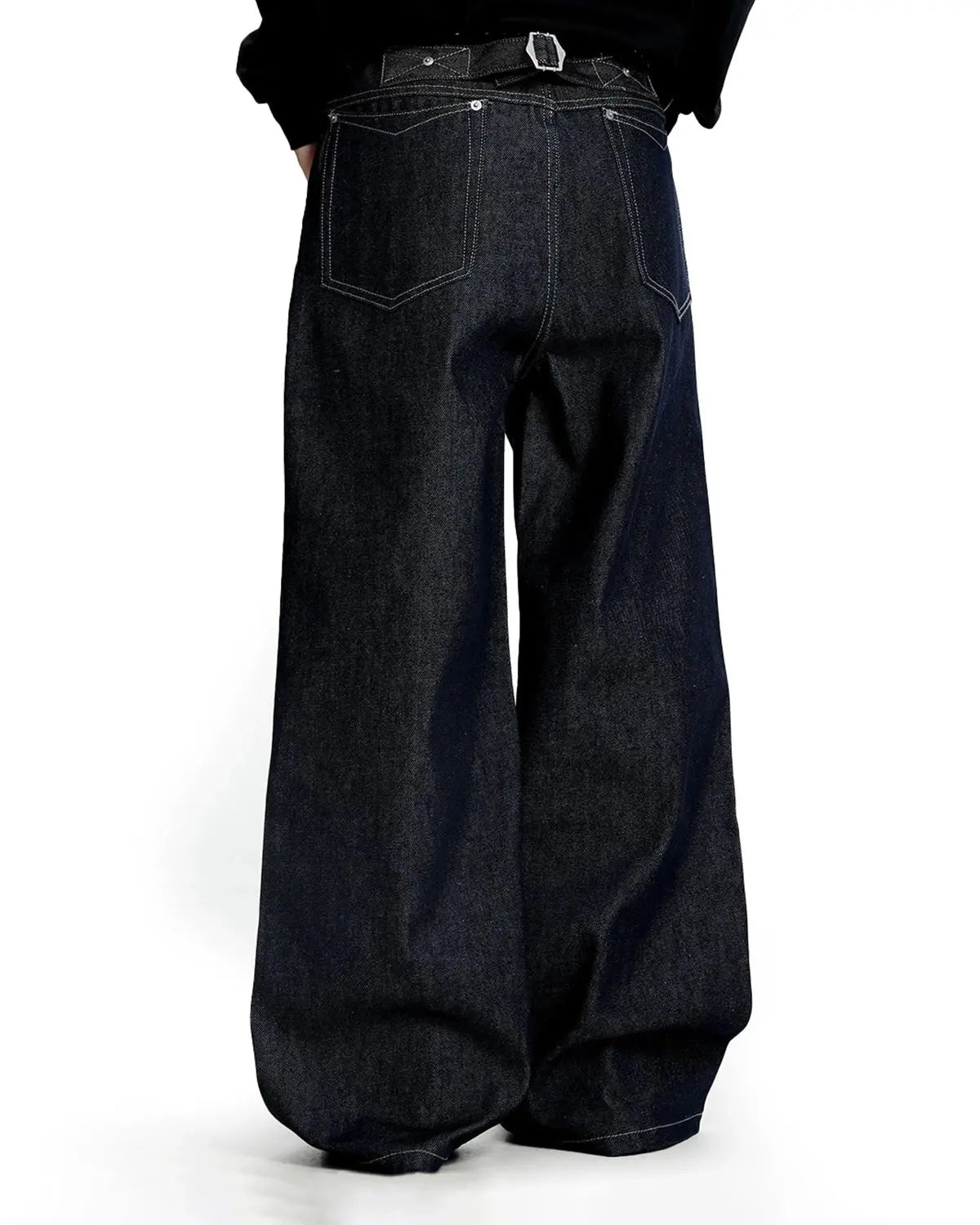 Raw baggy jeans with contrast stitching by Flation Streetwear, featuring a relaxed fit and distressed denim style.