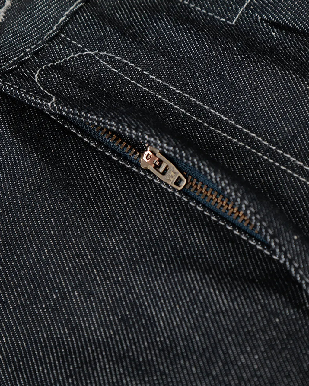 Raw baggy jeans by Flation with contrast stitching, featuring a relaxed fit and distressed denim style.