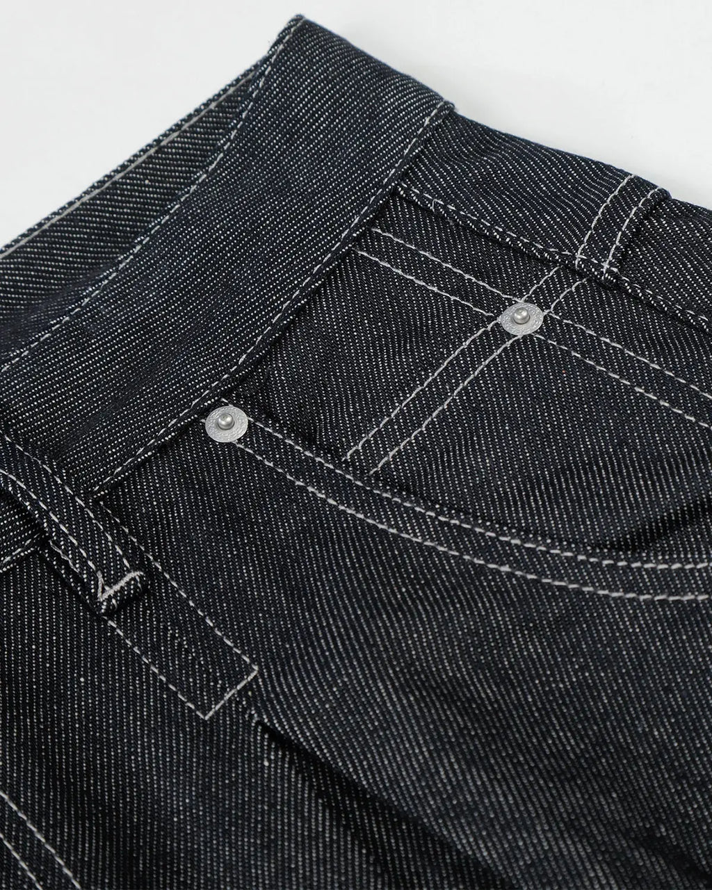Raw baggy jeans with contrast stitching from Flation Streetwear, featuring a relaxed fit and distressed detailing.