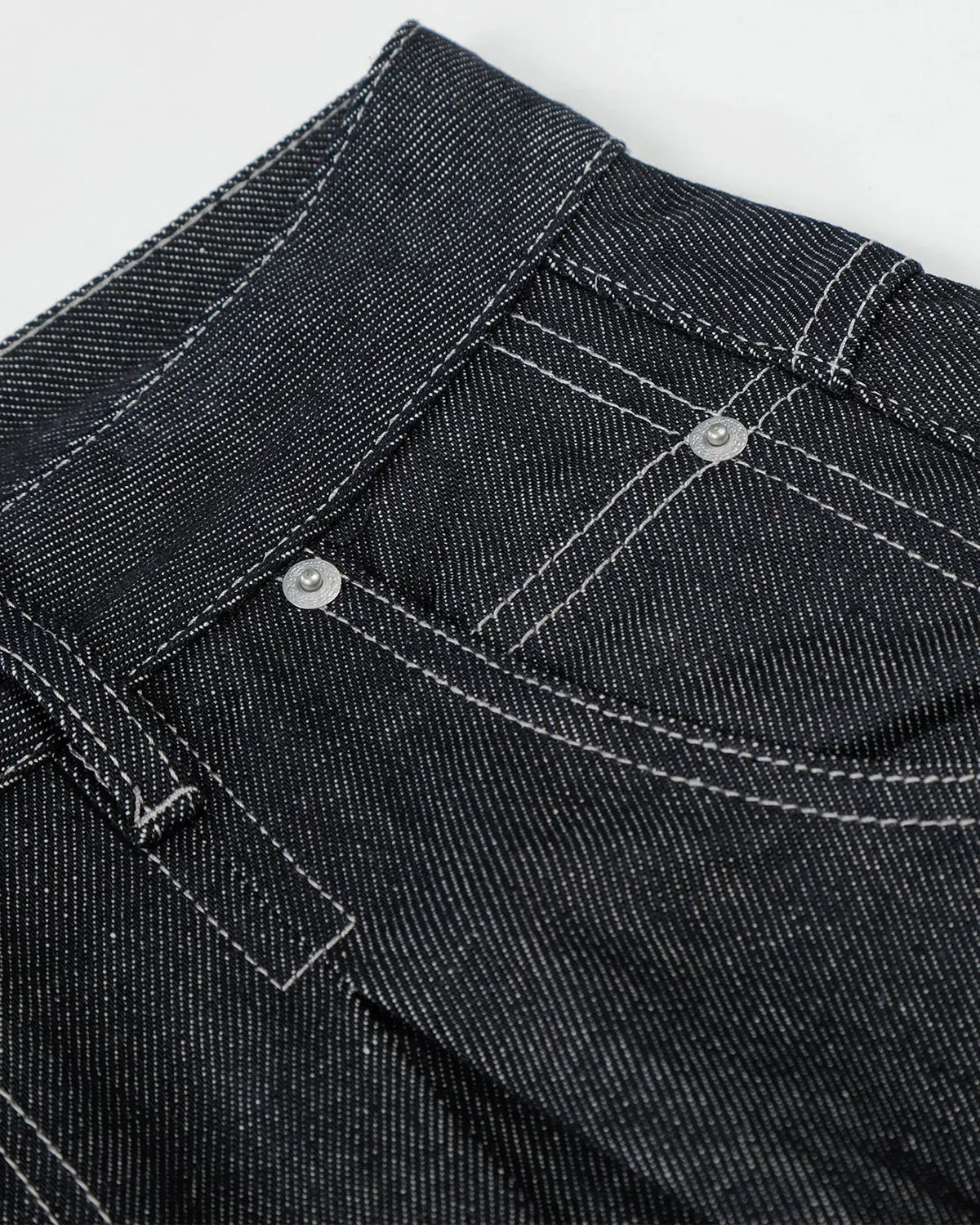 Raw baggy jeans with contrast stitching from Flation Streetwear, featuring a relaxed fit and distressed detailing.