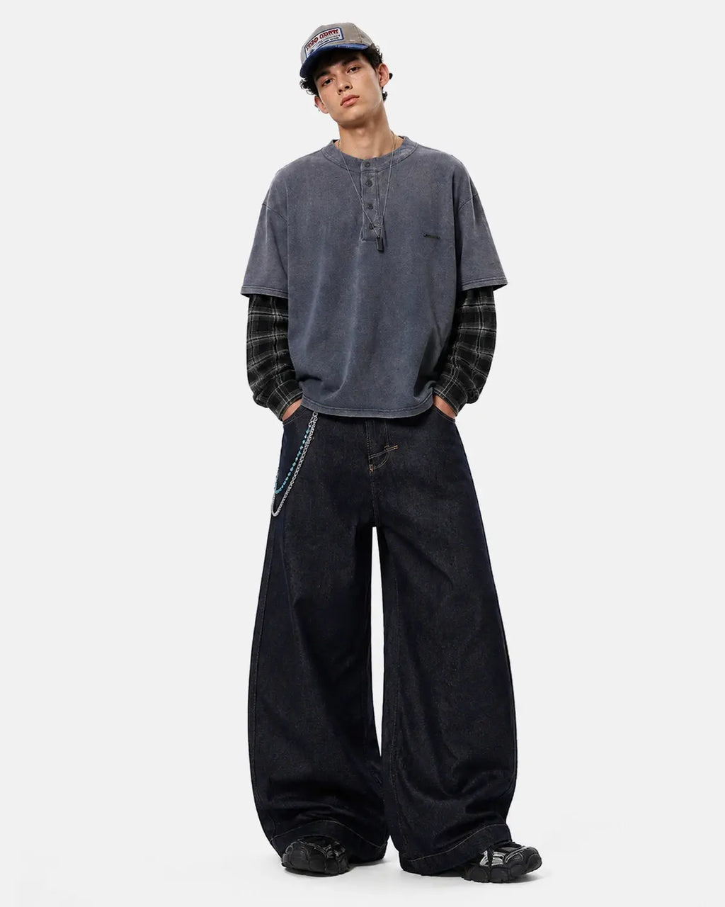 Raw Wash Barrel Jeans with Cinch Back from Flation Streetwear, showing distressed denim fabric and adjustable waist cinch detail.