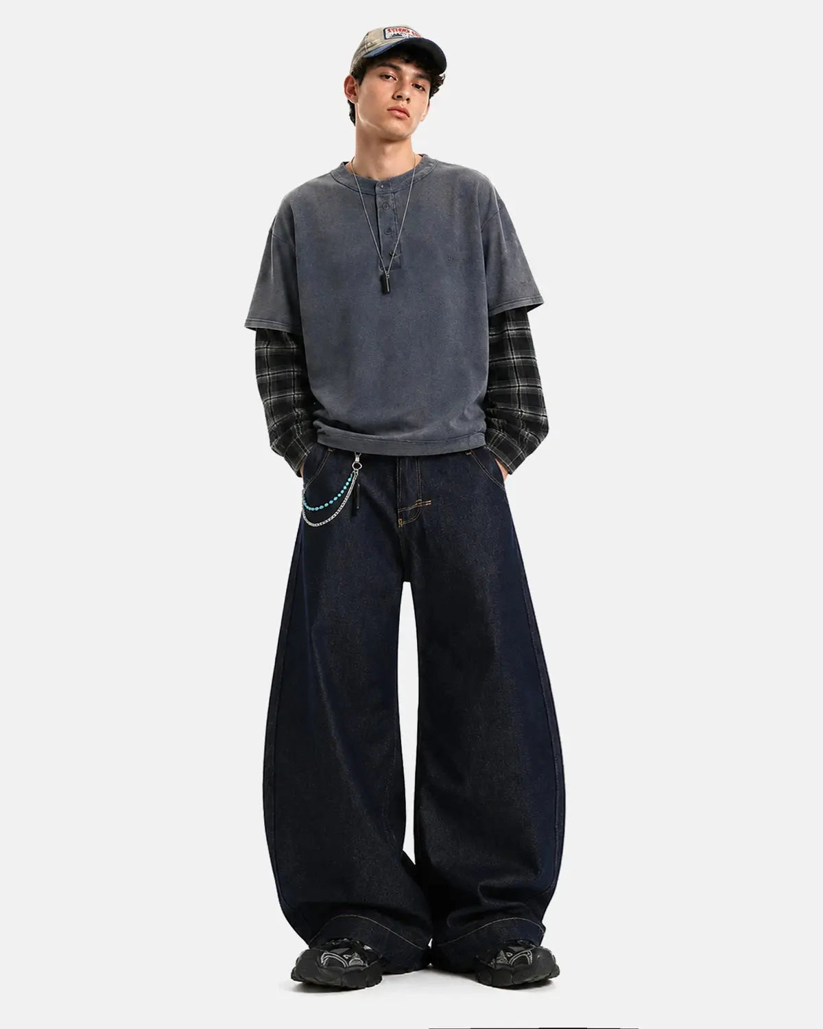 Raw wash barrel jeans with cinch back from Flation Streetwear, featuring distressed denim and tapered fit in the image.