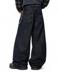 Raw wash barrel jeans with cinch back from Flation Streetwear, featuring a relaxed fit and distressed denim details