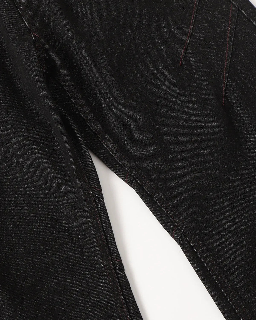 Raw bootcut jeans with deconstructed stitching from Flation Streetwear, shown with distressed details and classic blue denim fabric.