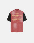 Patchwork washed graphic T-shirt by Flation featuring colorful patchwork design and streetwear style, displayed on a hanger.