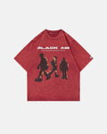 Red washed oversized graphic T-shirt by Flation Streetwear featuring bold printed design and relaxed fit.