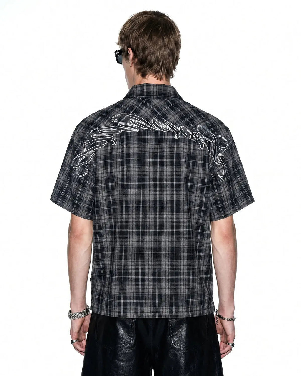 Flation plaid script embroidered shirt featuring a stylish checkered pattern and embroidered lettering on the front.