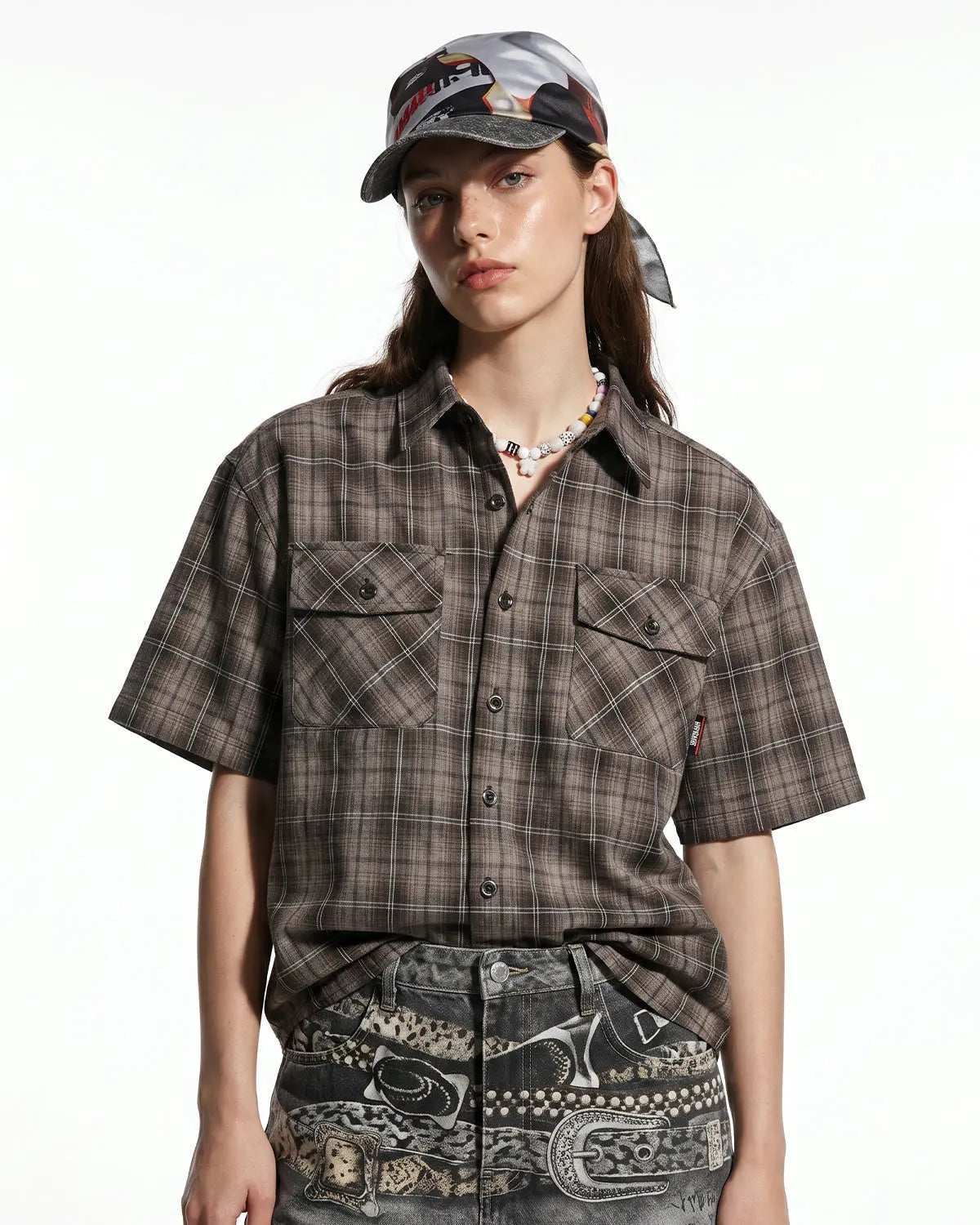 Flation plaid script embroidered shirt featuring a classic checkered pattern and detailed embroidery on the front.