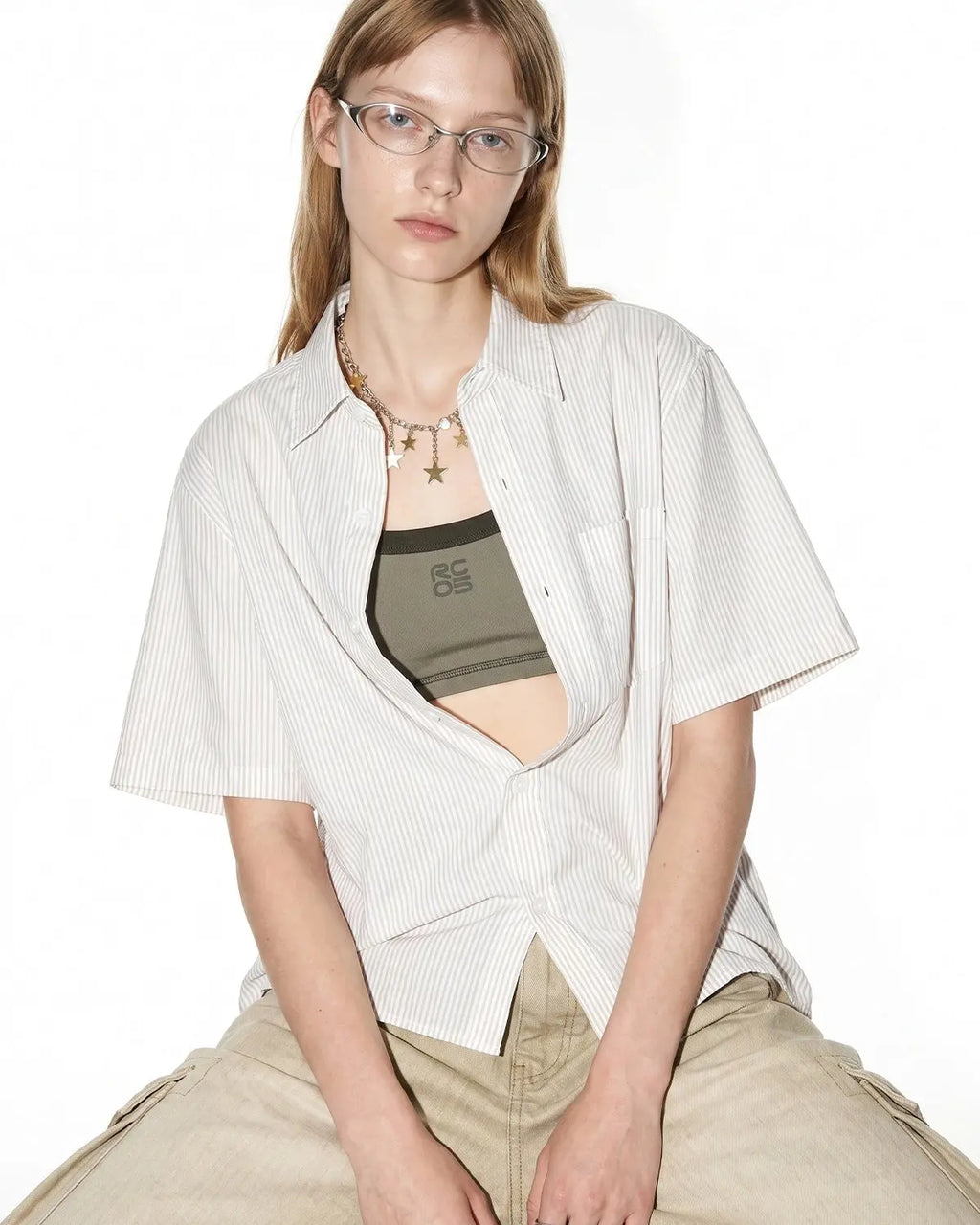 Black Flation streetwear boxy striped short-sleeve shirt with a relaxed fit and bold horizontal stripe pattern.
