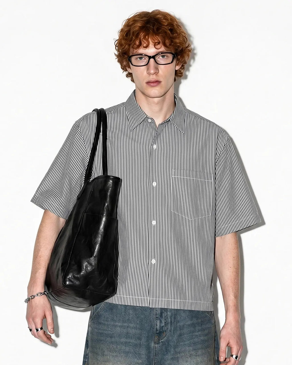 Black boxy striped short-sleeve shirt by Flation Streetwear, featuring bold horizontal stripes and a relaxed fit.