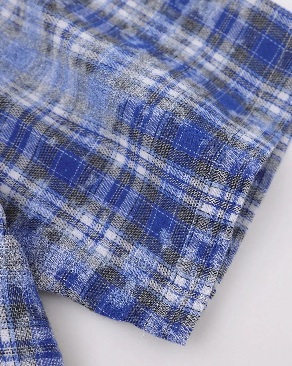 Blue Flation streetwear plaid shirt featuring embroidered devil design, long sleeves, and classic button-up style.