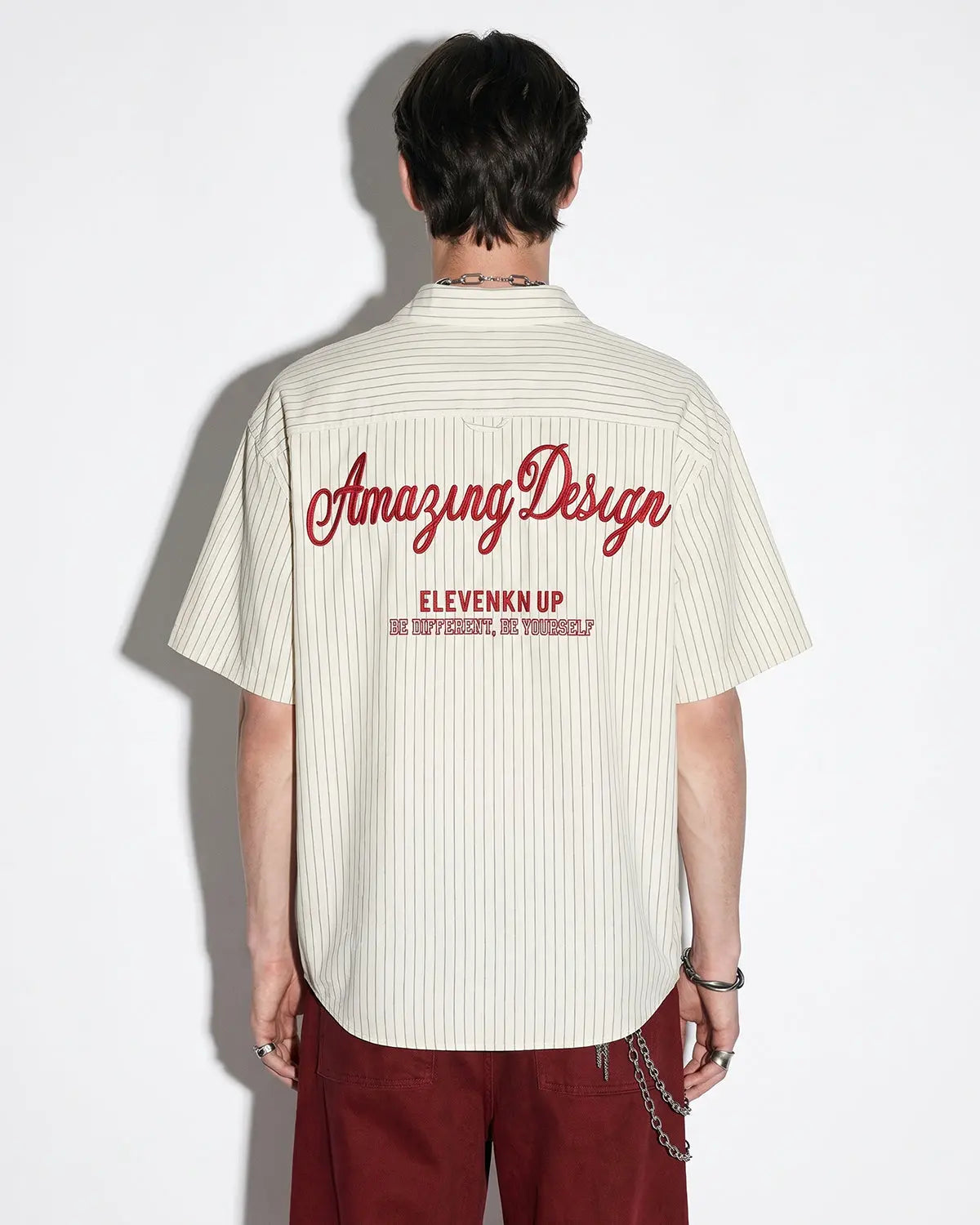 Striped embroidered short-sleeve shirt by Flation Streetwear featuring vibrant patterns and casual fit.