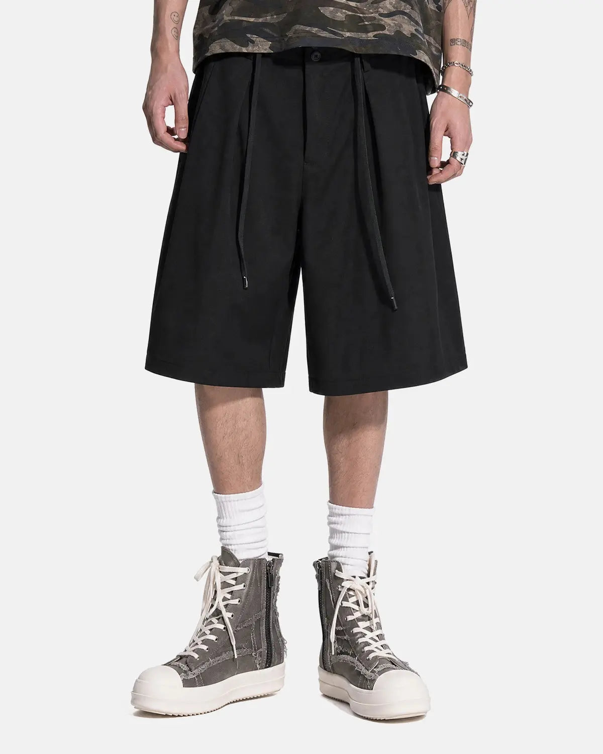 Black drawstring wide-leg tailored shorts by Flation Streetwear, featuring a relaxed fit and structured design for casual style.