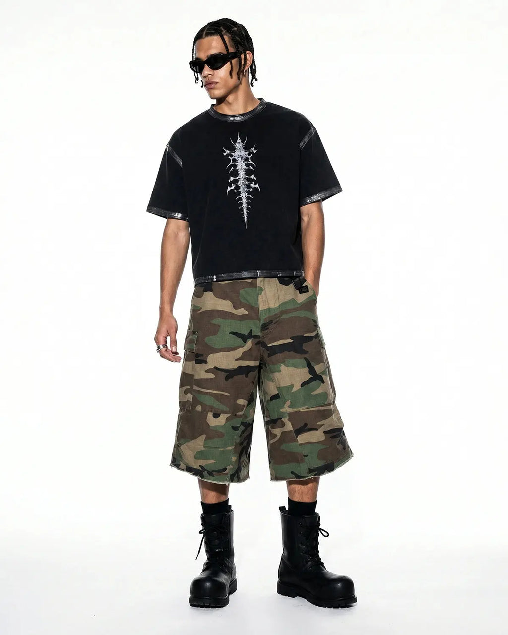Oversized camo cargo longline shorts by Flation, featuring a relaxed fit, multiple pockets, and a trendy streetwear style.