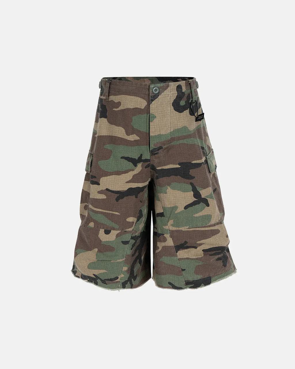 Oversized camo cargo longline shorts from Flation Streetwear, featuring green camouflage fabric and multiple utility pockets.
