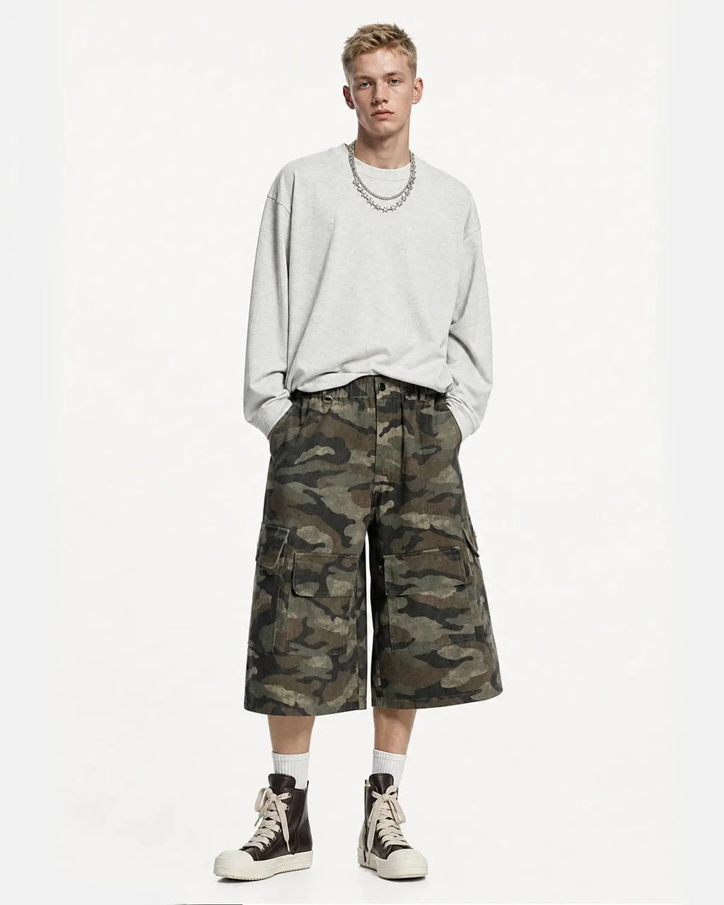 Grey camo Flation utility longline shorts with multiple pockets and relaxed fit, styled for streetwear fashion.
