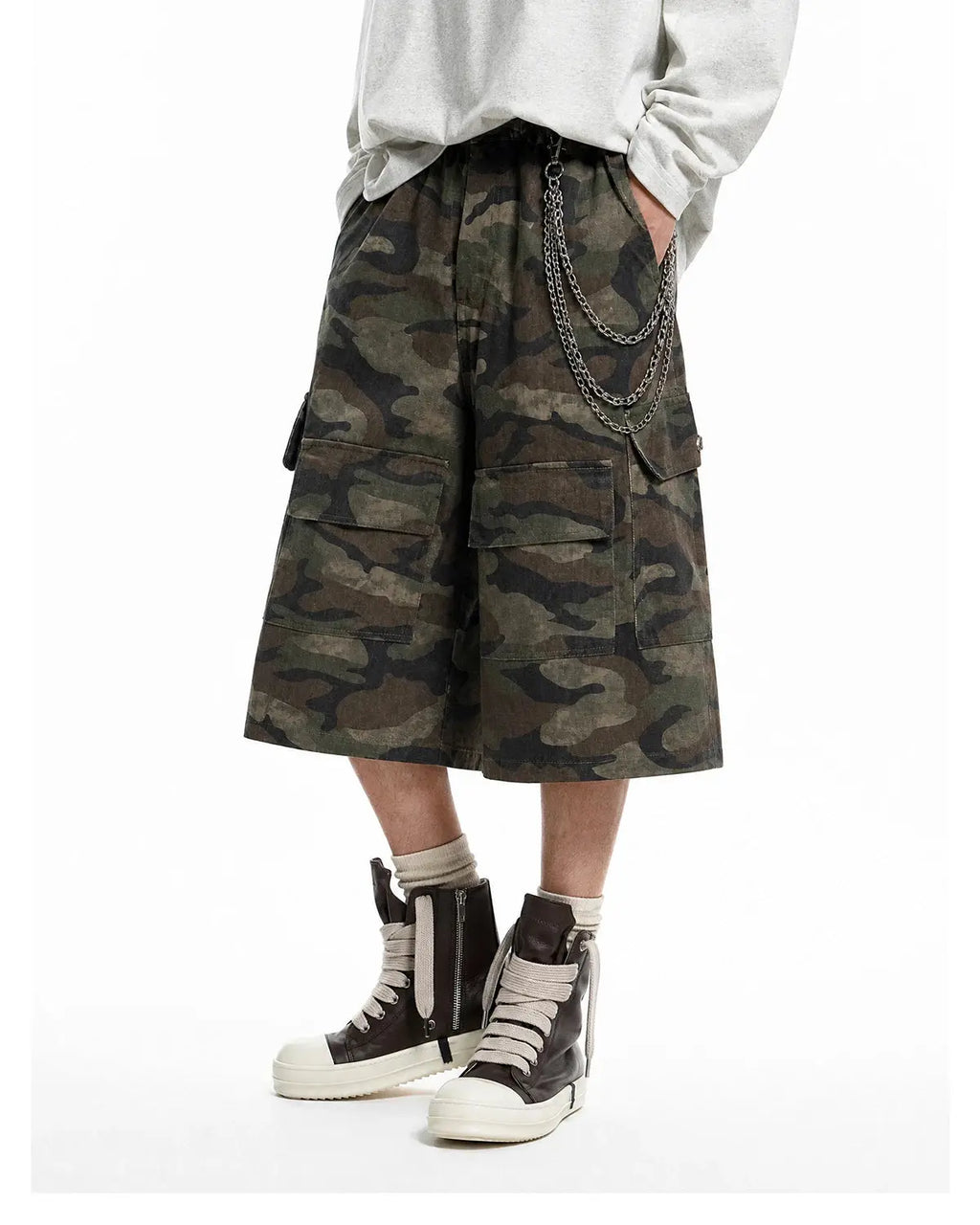 Grey camo utility longline shorts by Flation Streetwear, featuring a relaxed fit and cargo pockets for a casual, urban look.