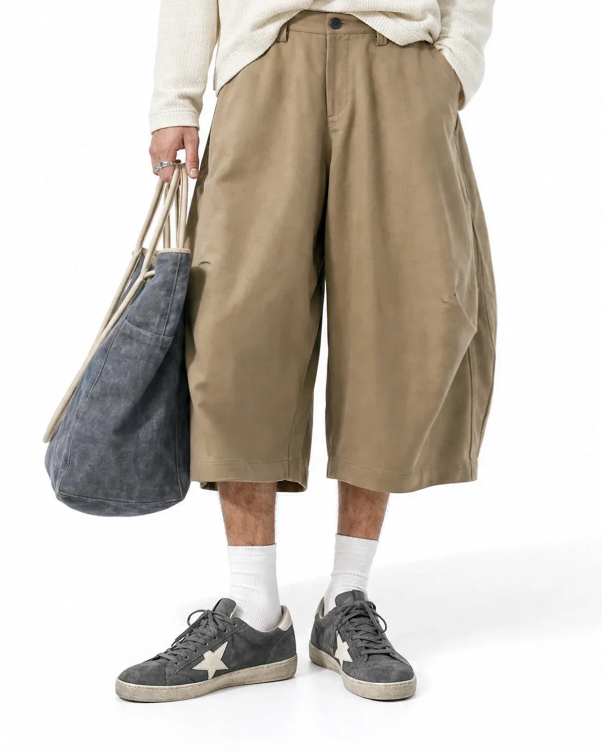 Pair of Flation Streetwear pleated barrel-tailored Bermuda shorts in beige, featuring a relaxed fit and tailored pleats.