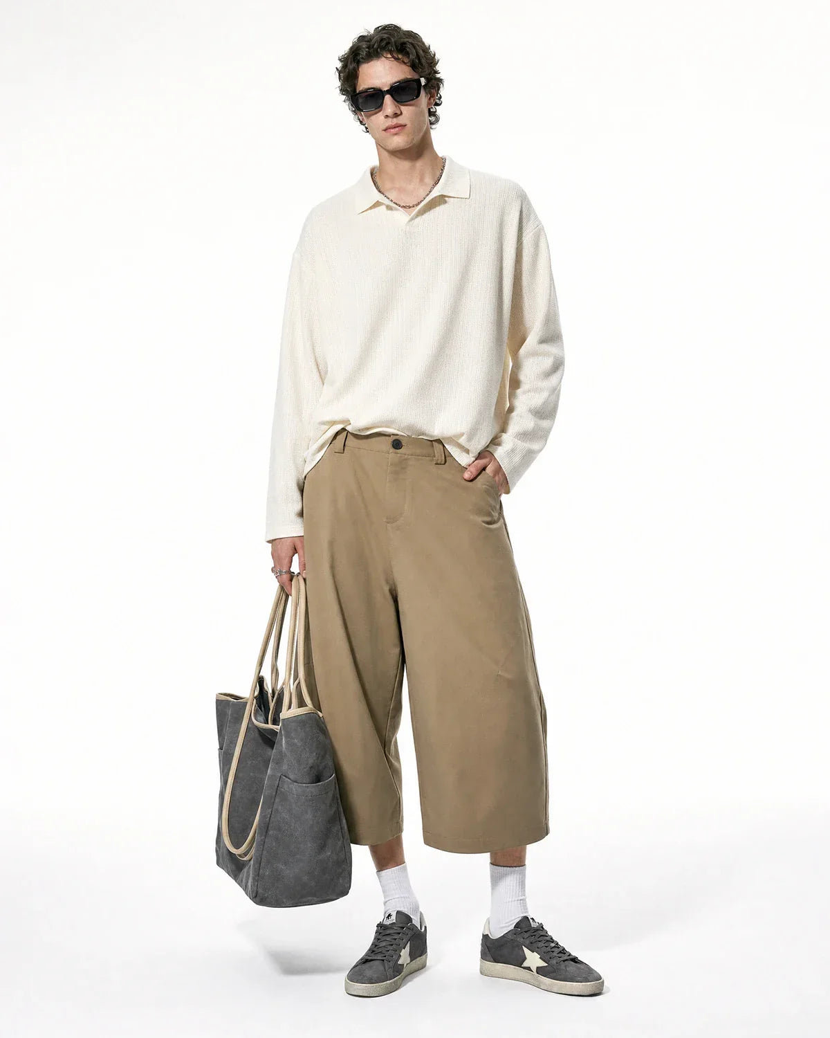 Flation Pleated Barrel Tailored Bermuda Shorts featuring a high waist, pleated design, and tailored fit in lightweight fabric.
