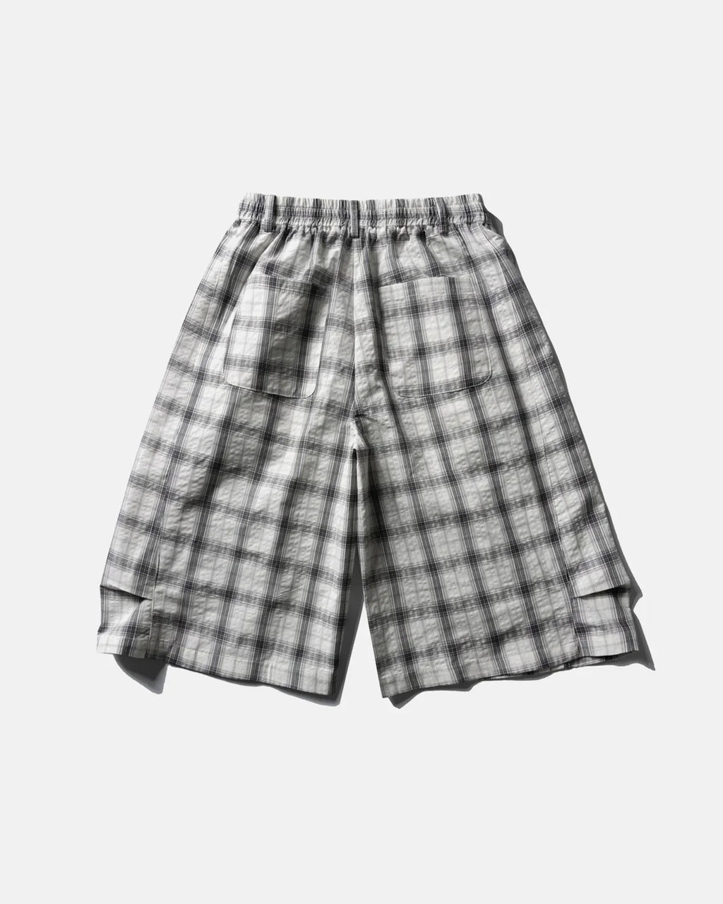 Flation plaid longline casual shorts with a checkered pattern, featuring a relaxed fit and belt loops.