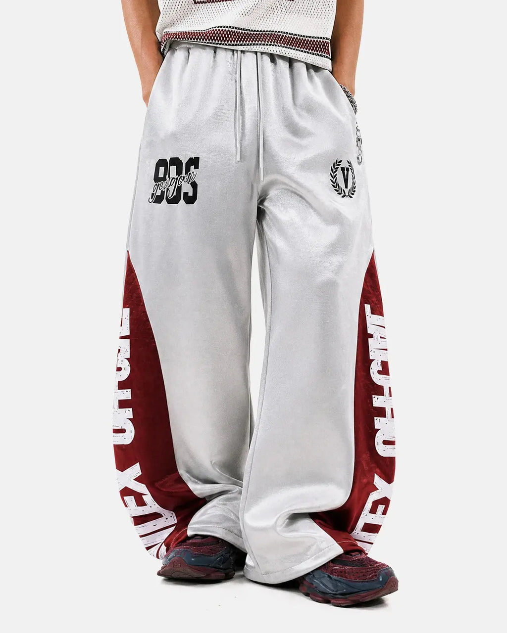 Black glossy contrast barrel sweatpant by Flation Streetwear, featuring a relaxed fit and stylish design.