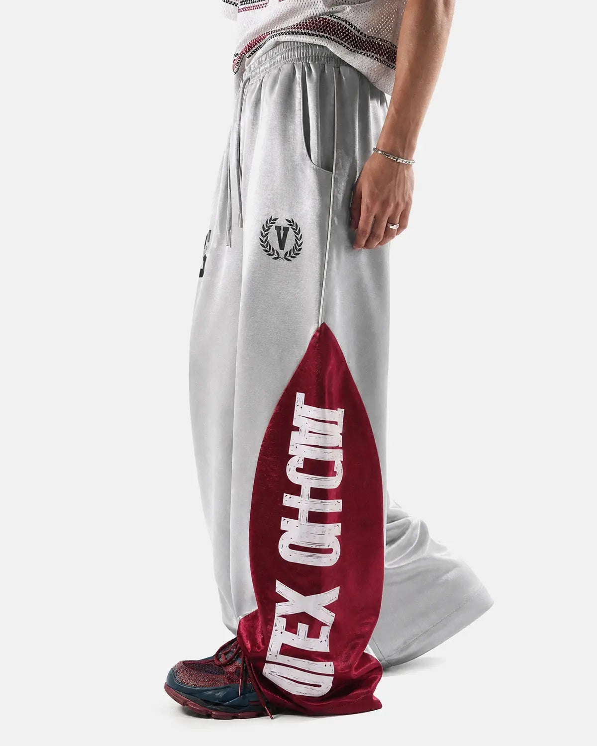 Black glossy contrast barrel sweatpant by Flation Streetwear, featuring a relaxed fit and stylish design.