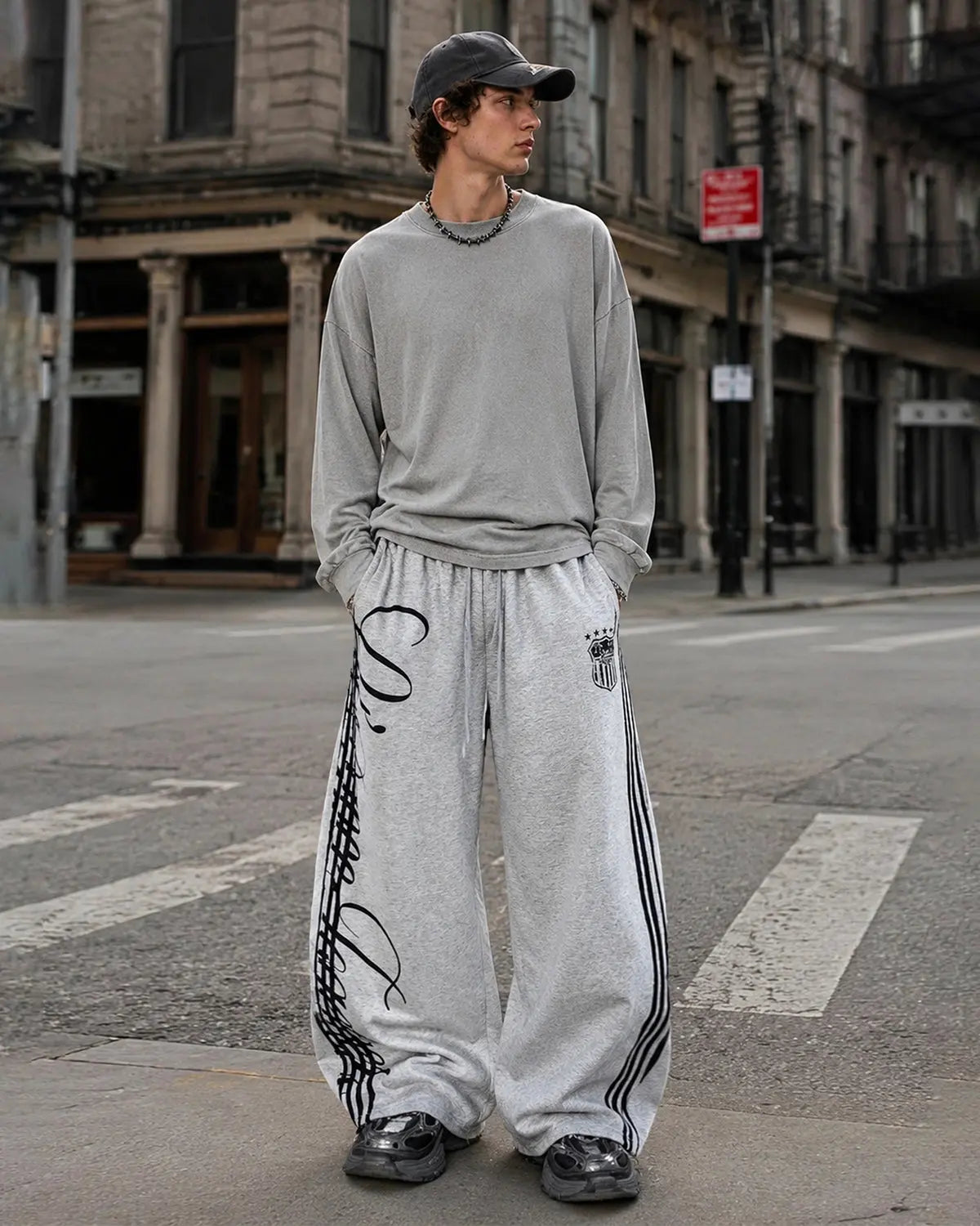 Flation Script Stripe Baggy Sweatpants, relaxed fit streetwear pants with bold script stripe design in soft fabric.