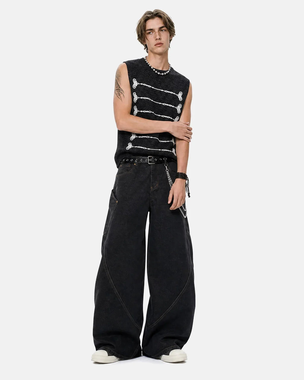 Black embroidered knit tank top by Flation Streetwear, stylish T-shirt with detailed embroidery and comfortable fit.