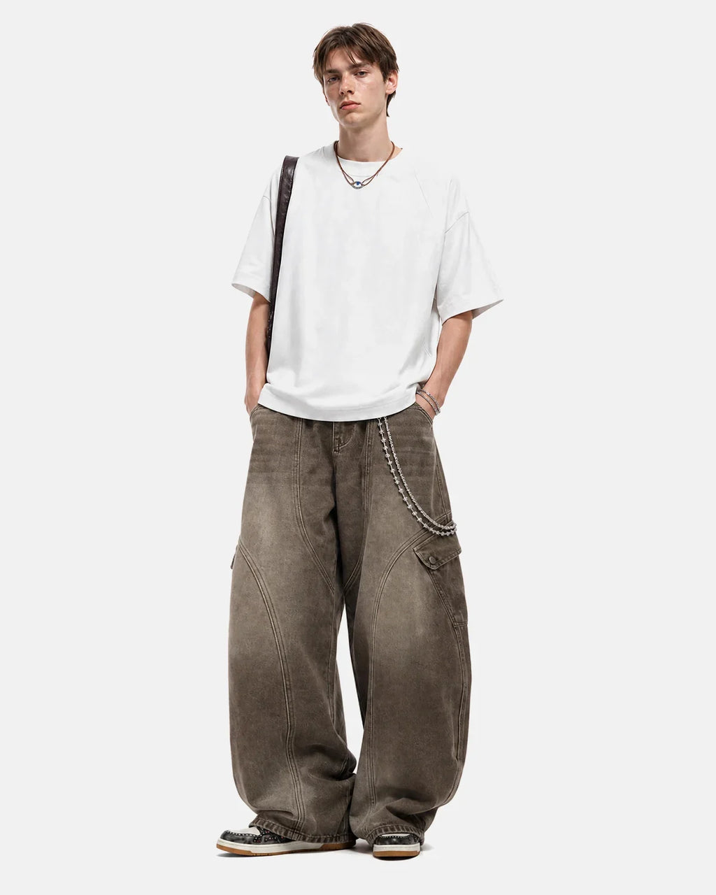 Off-white boxy deconstructed Flation Streetwear T-shirt with relaxed fit and modern design, displayed on a plain background.