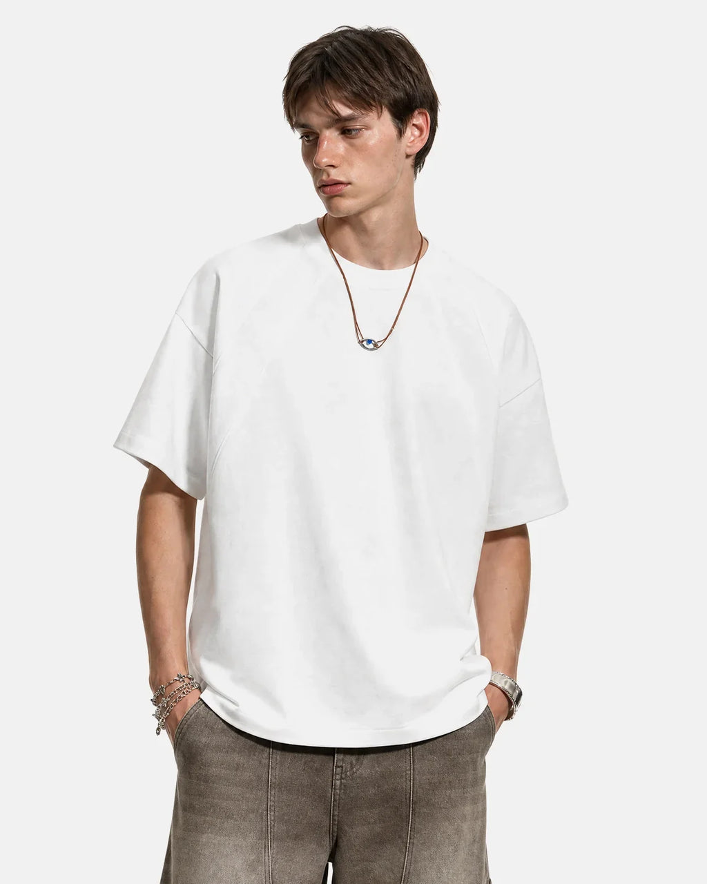 Off-white boxy deconstructed T-shirt by Flation Streetwear with relaxed fit and casual style, displayed flat on a white background.