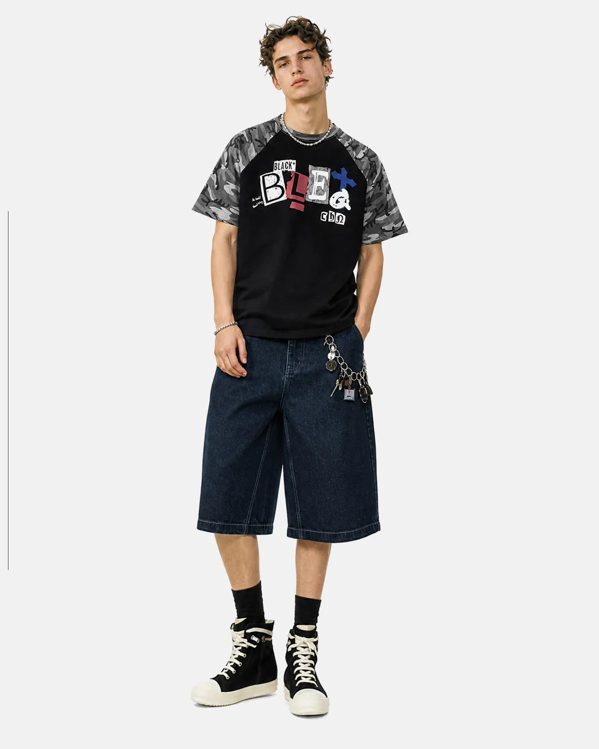 Black camo sleeve graphic boxy T-shirt by Flation Streetwear with bold camo design on sleeves and relaxed fit.