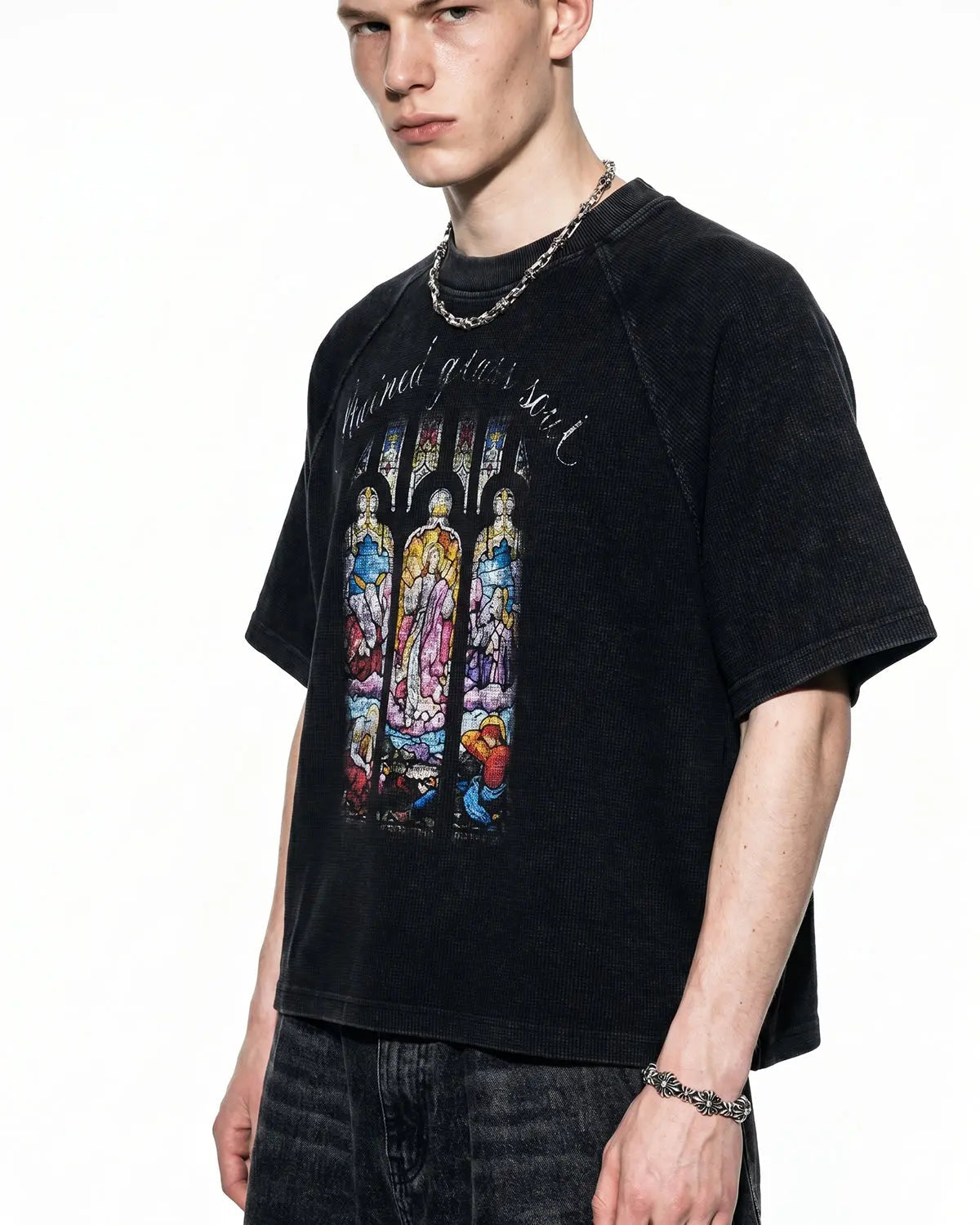 Black Flation graphic boxy waffle T-shirt featuring washed fabric and streetwear style, displayed on a flat surface.