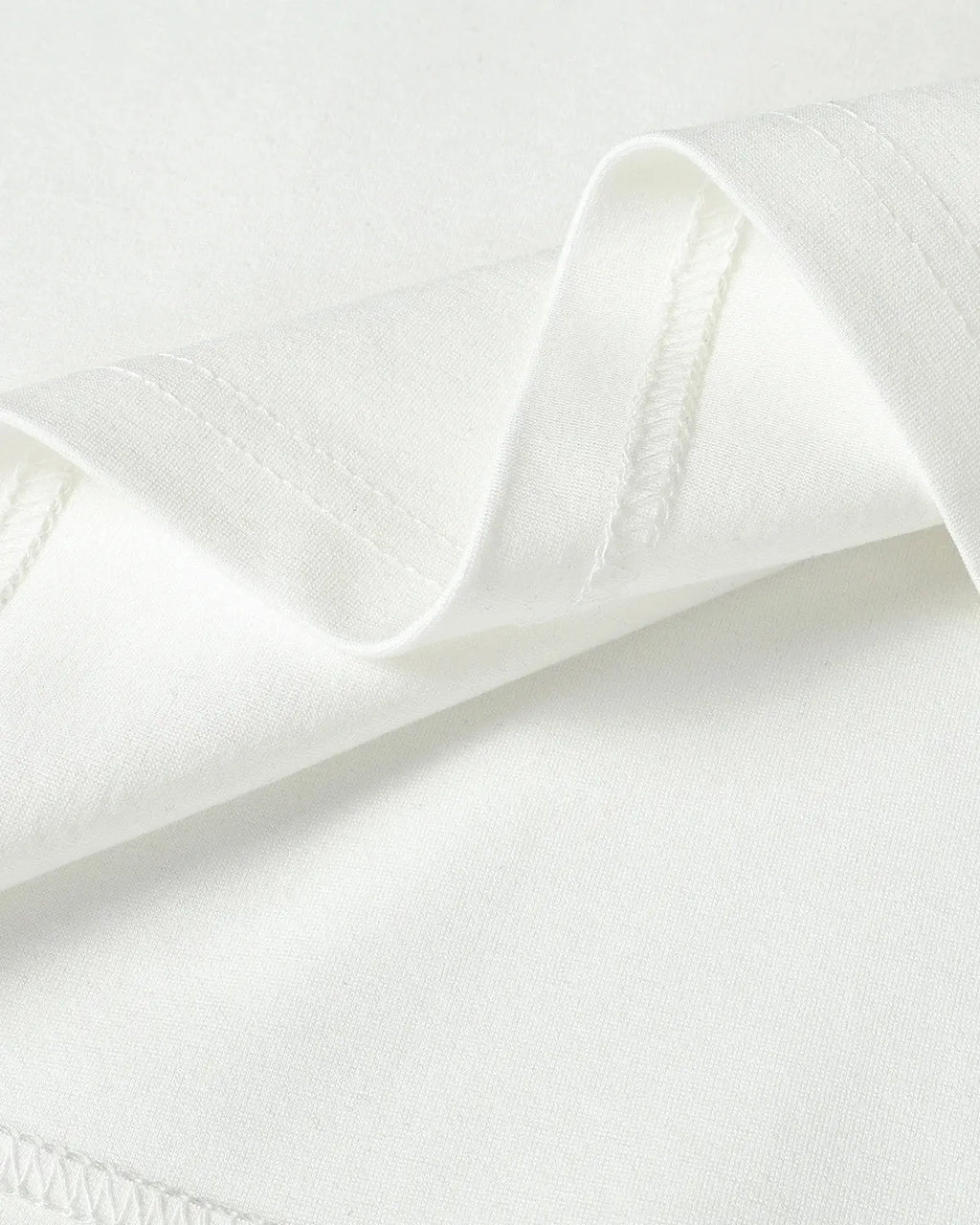 White cotton T-shirt with metal buckle detail from Flation Streetwear, casual fit with stylish embellishments.