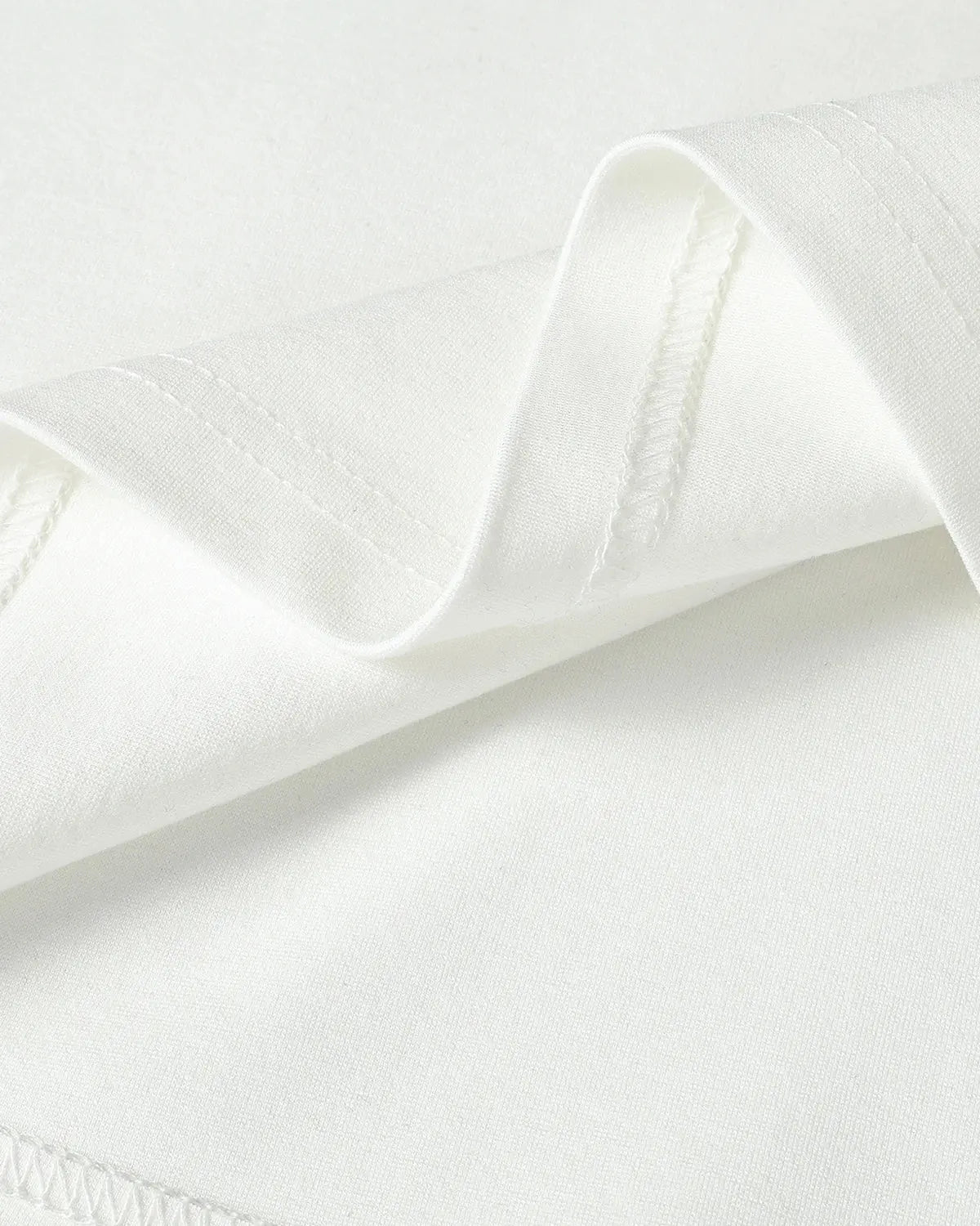 White cotton T-shirt with metal buckle detail from Flation Streetwear, casual fit with stylish embellishments.