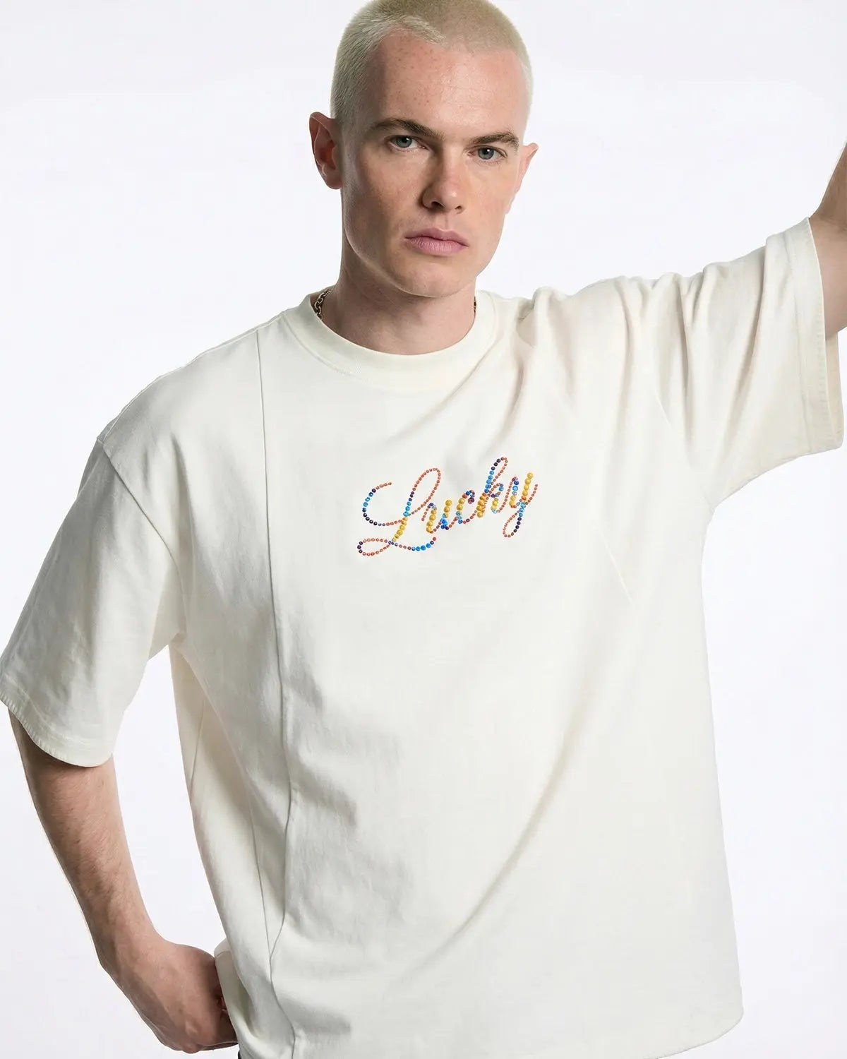 Flation Rhinestone Lucky graphic oversized T-shirt featuring bold design and vibrant rhinestone details on soft streetwear fabric.