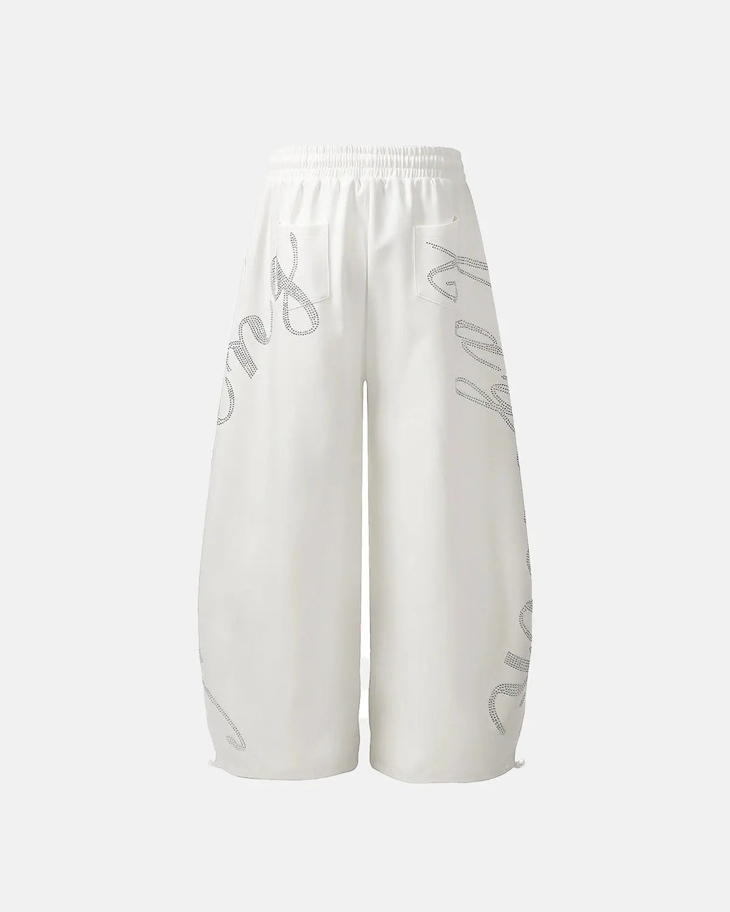 White rhinestone baggy joggers by Flation Streetwear, featuring a relaxed fit and sparkling rhinestone details.