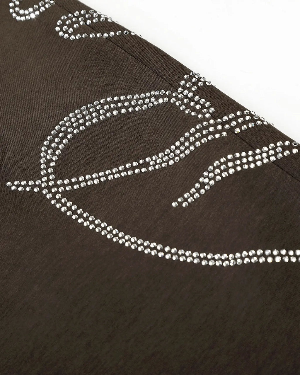 White rhinestone baggy joggers by Flation Streetwear featuring sparkling rhinestone details and a relaxed, oversized fit.