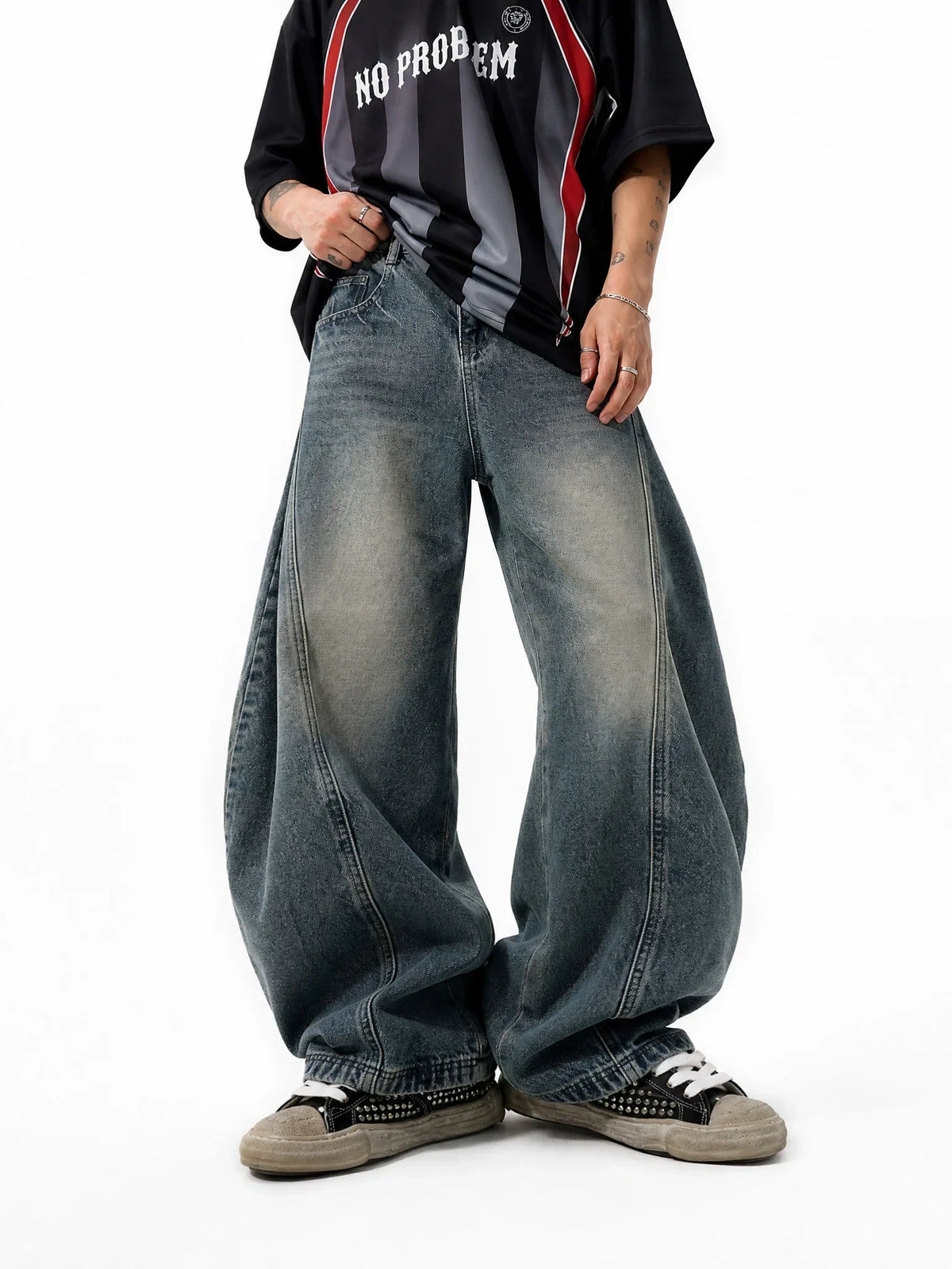 Distressed Flation Streetwear Supper Baggy Jeans, casual pants with ripped details and relaxed fit, shown on a model.
