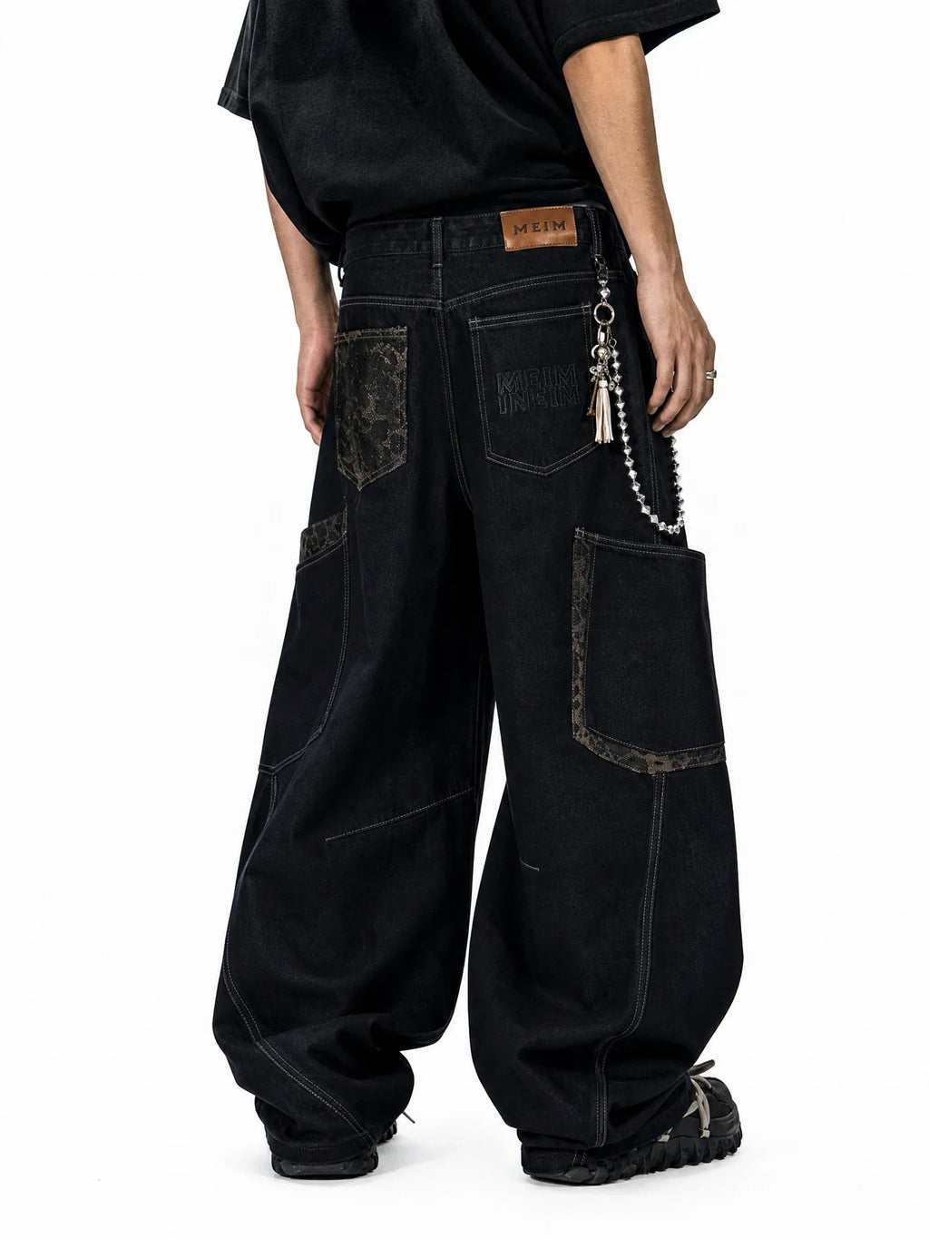 Leopard patchwork barrel jeans by Flation Streetwear featuring bold animal print and relaxed fit denim style.
